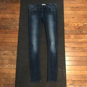 Mid-rise dark wash/washed out skinny jeans